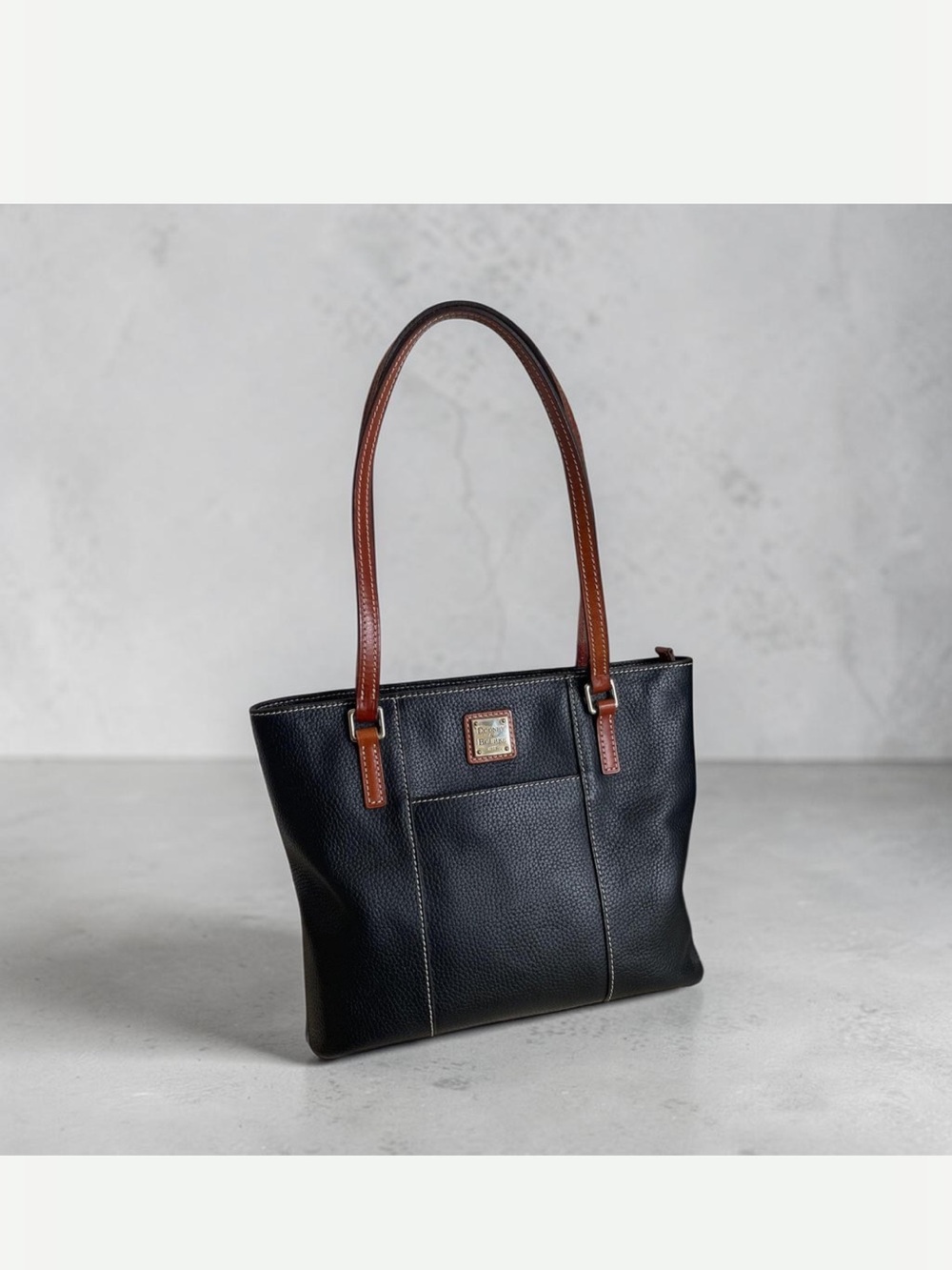 Dooney & Bourke Black Leather Tote with Brown Handles